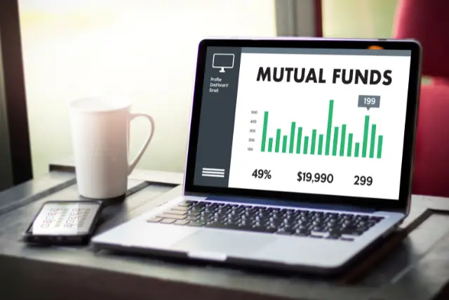 Laptop that has a bar graph with percentages and the words "mutual funds"