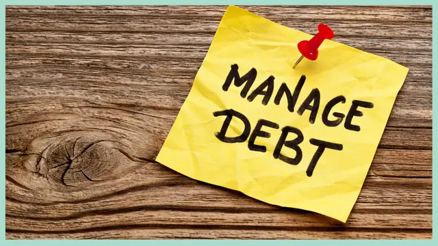 Sticky note that says Manage Debt