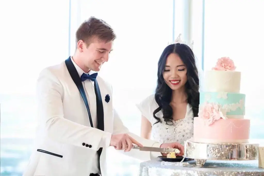 Cutting our wedding cake that was under three hundred dollars
