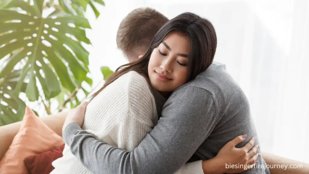 Couple hugging and showing love and patience when discussing finances