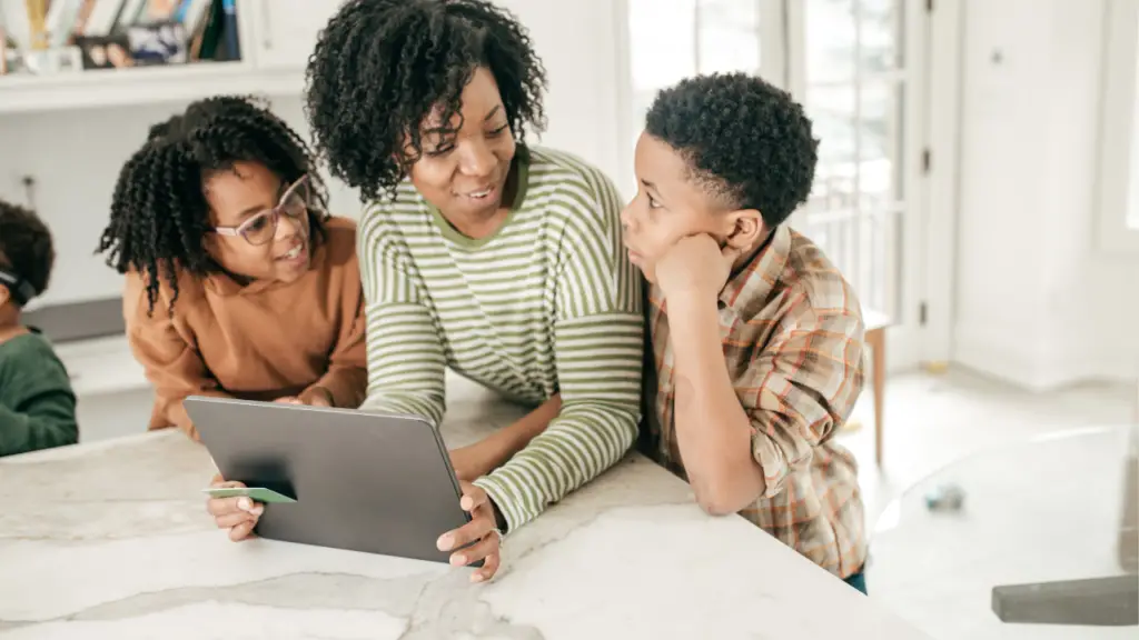 Mother teaching two kids about finance