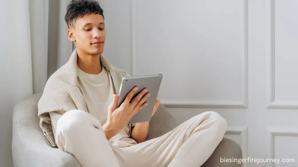 Person on couch reading a real estate book on their tablet