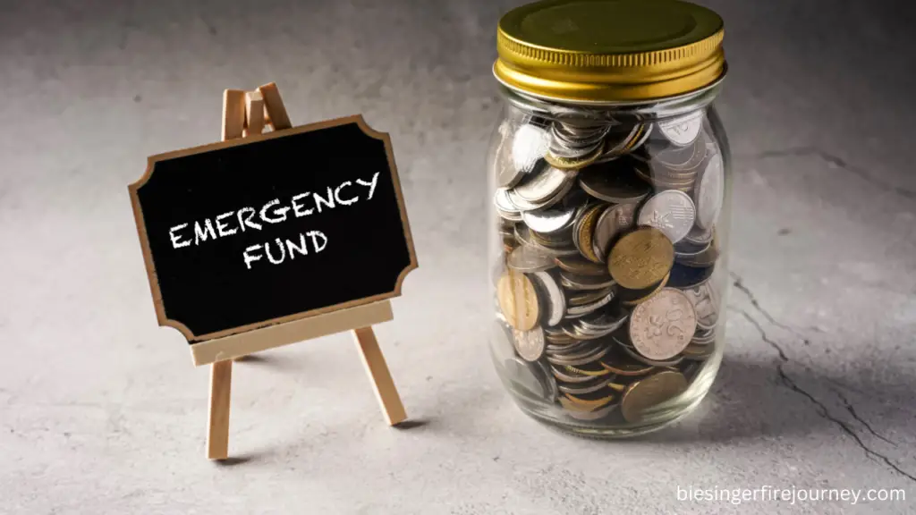 Jar filled with coins and a little sign that says "emergency fund"
