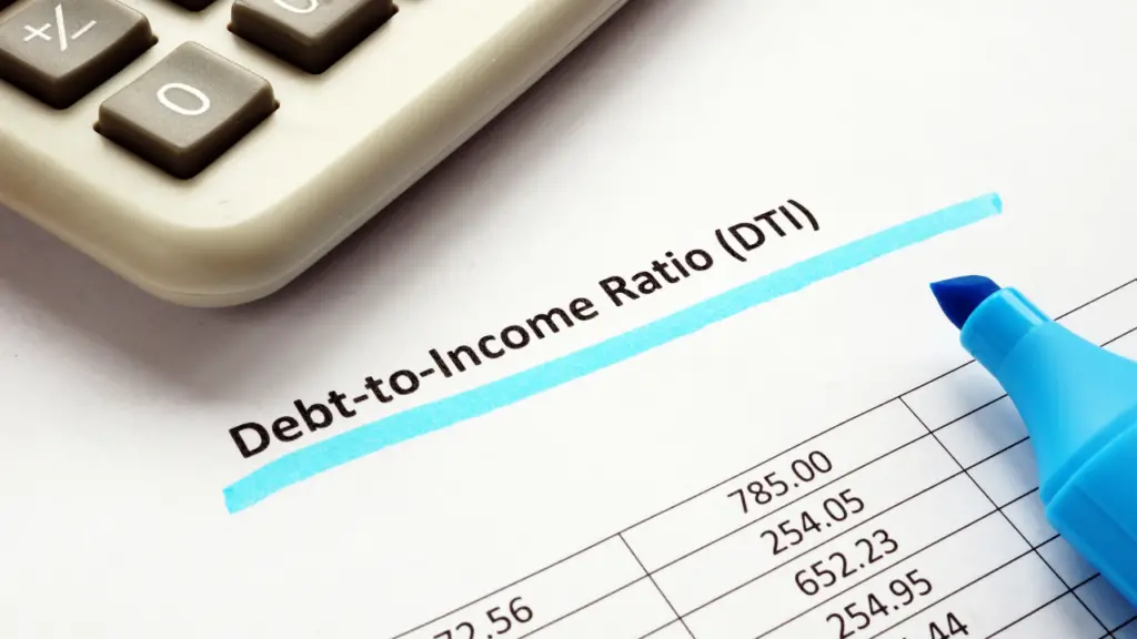 Paper that says "Debt-to-Income Ratio (DTI)" with a calculator on the paper