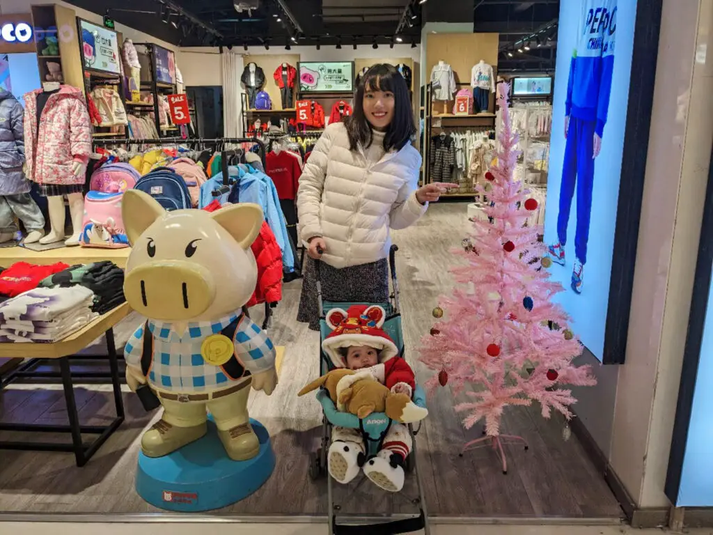 My wife with our daughter in a mall in China